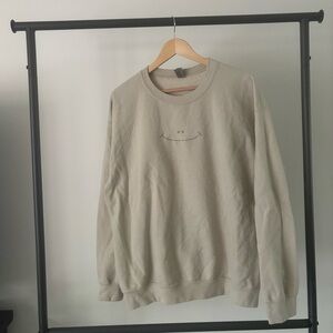 Etsy, smile embroidered tan sweatshirt, size medium.